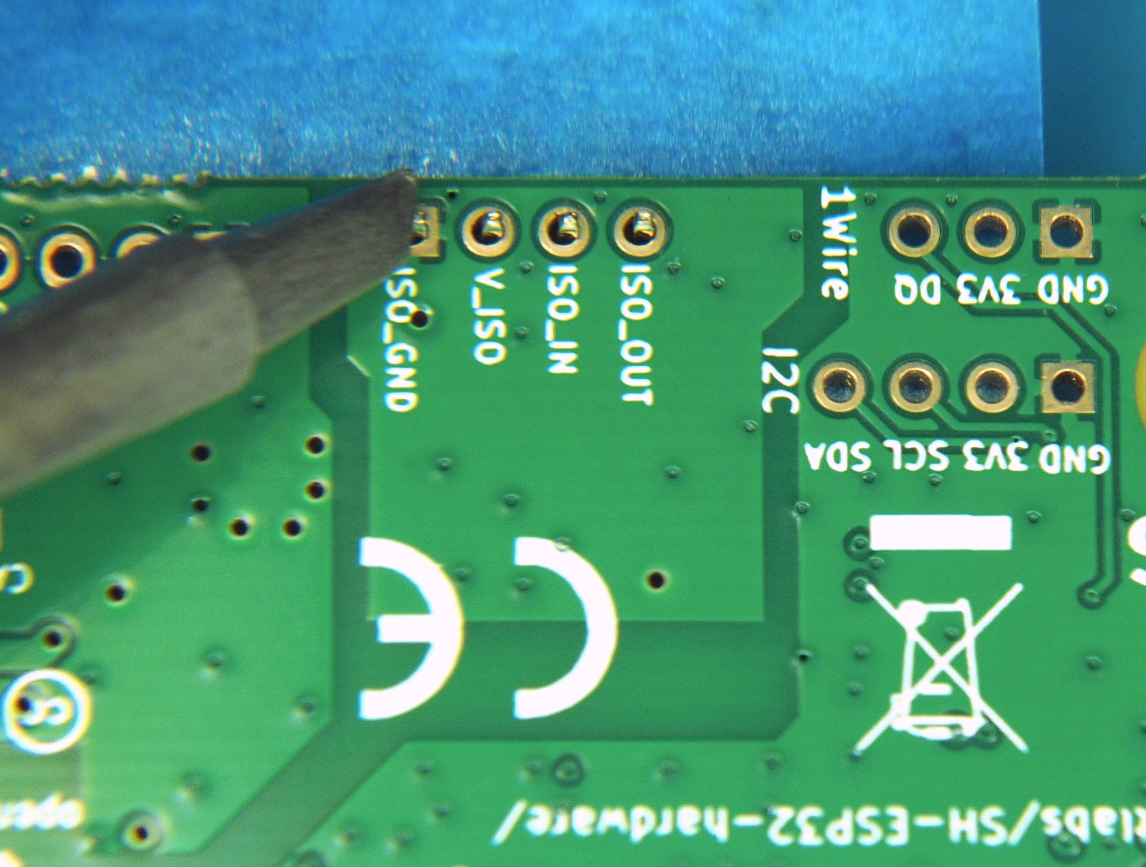 Solder iron tip against pin and pad