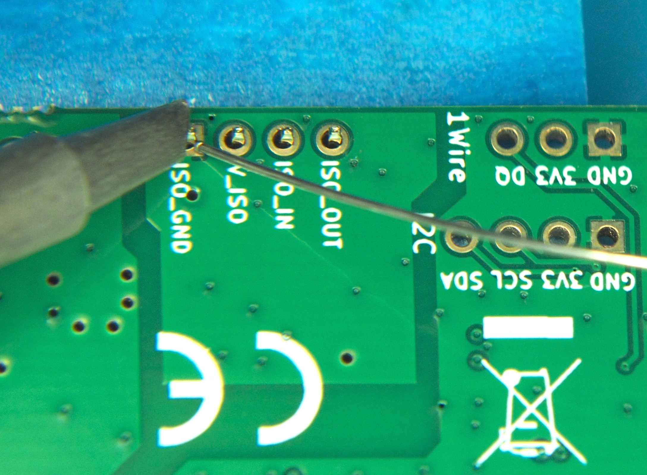 Feed solder wire from the opposite side